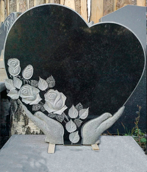 памятник в виде сердца на кладбище
